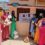 A group of women is standing outside a training facility.